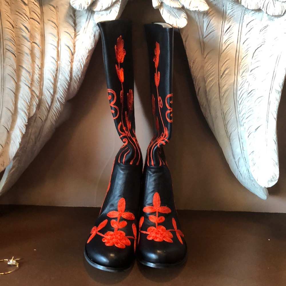 Black leather boots with red embroidery